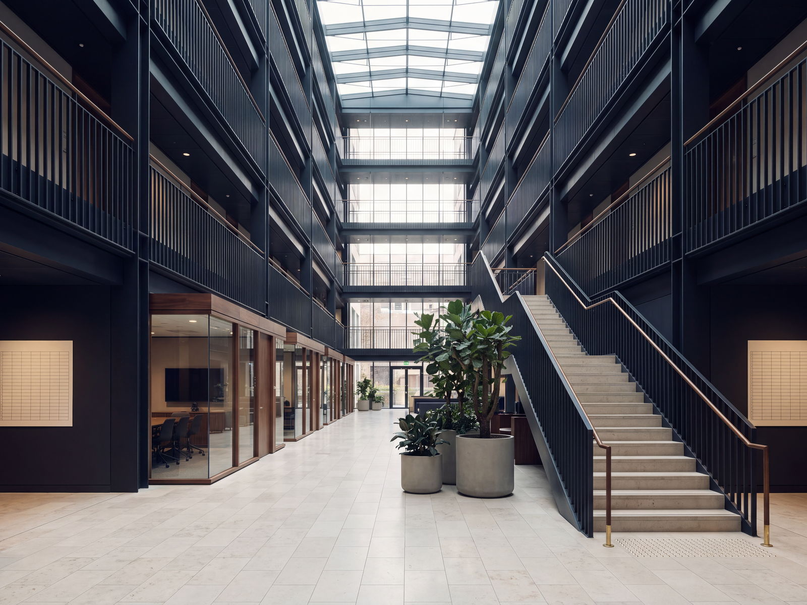 Daylit atrium of a modern office building, the working environment of the services economy.